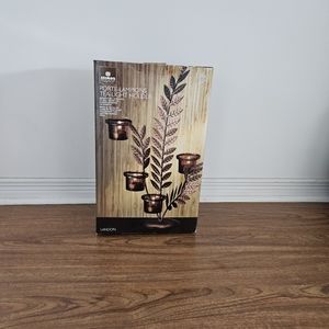 Tea light holder, brand new.